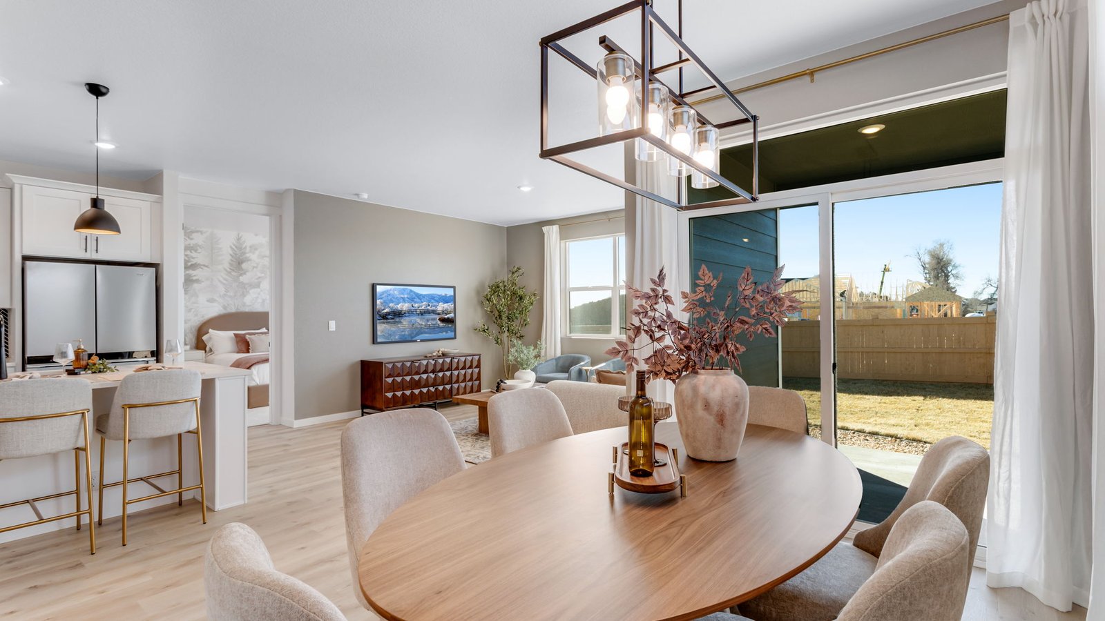 dining room with modern black light fixture in d.r. horton home windsor, co