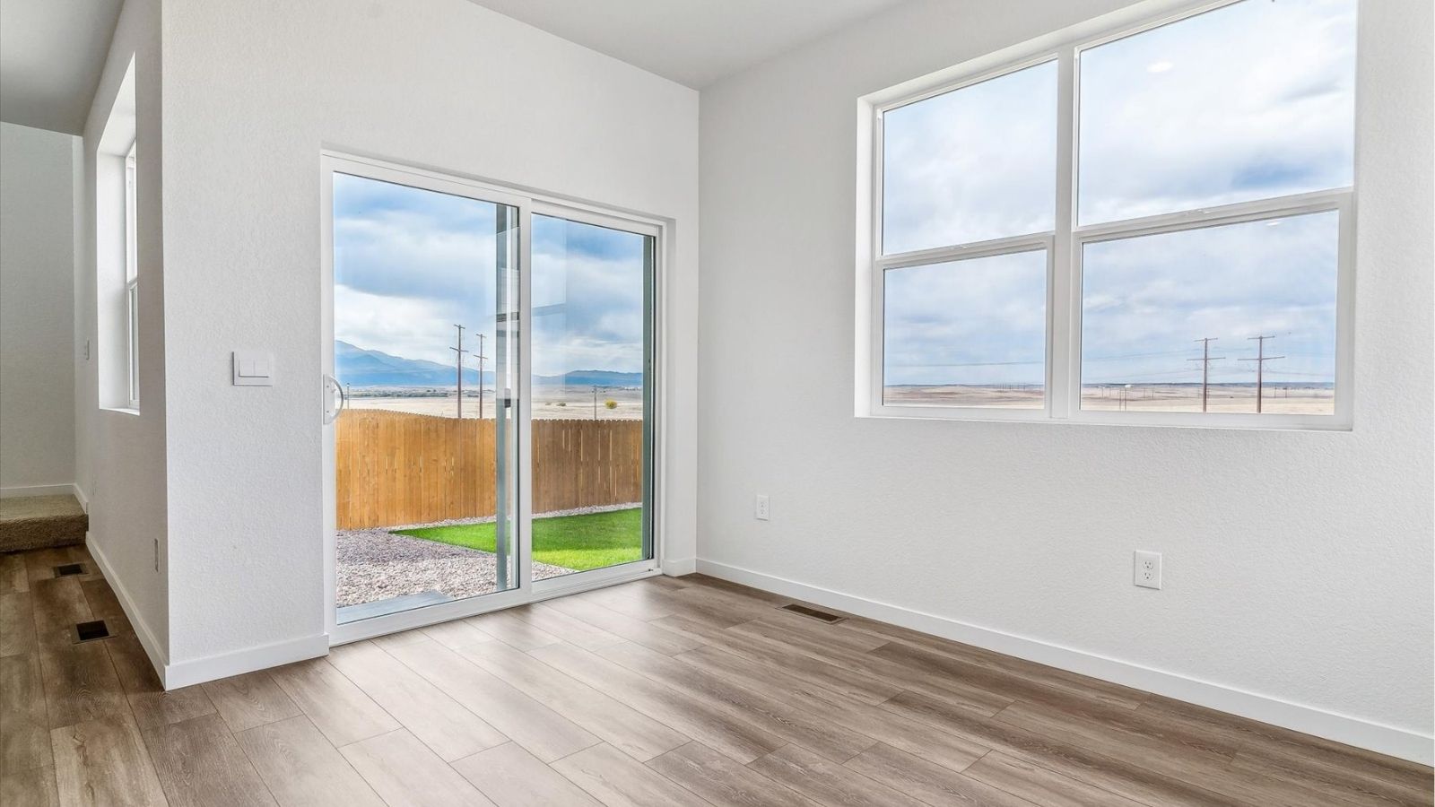 Dining area with sliding glass doors providing backyard access in the Cabral floorplan home at The Ridge at Johnstown.