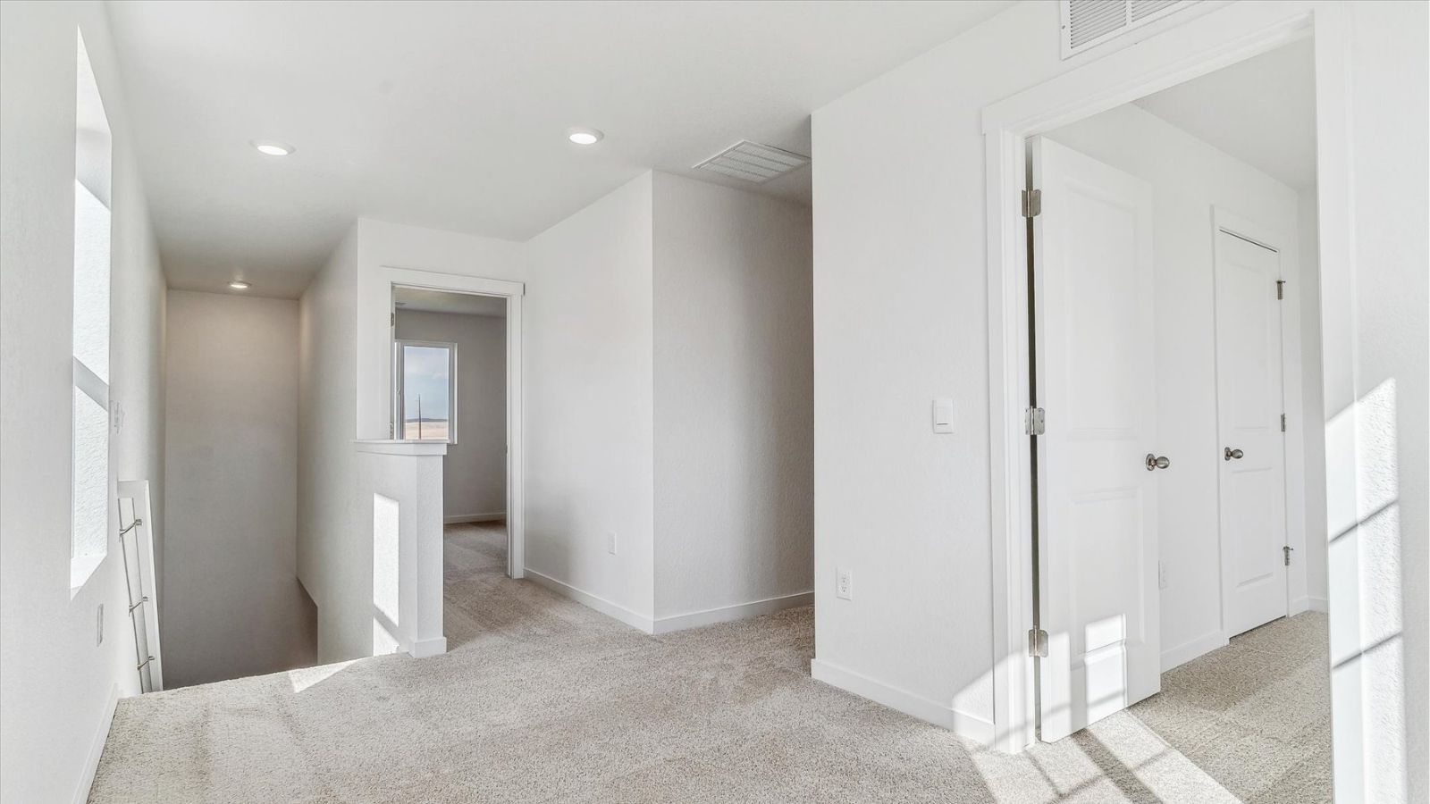Primary bedroom with spacious layout and natural light in the Cabral floorplan at The Ridge at Johnstown.