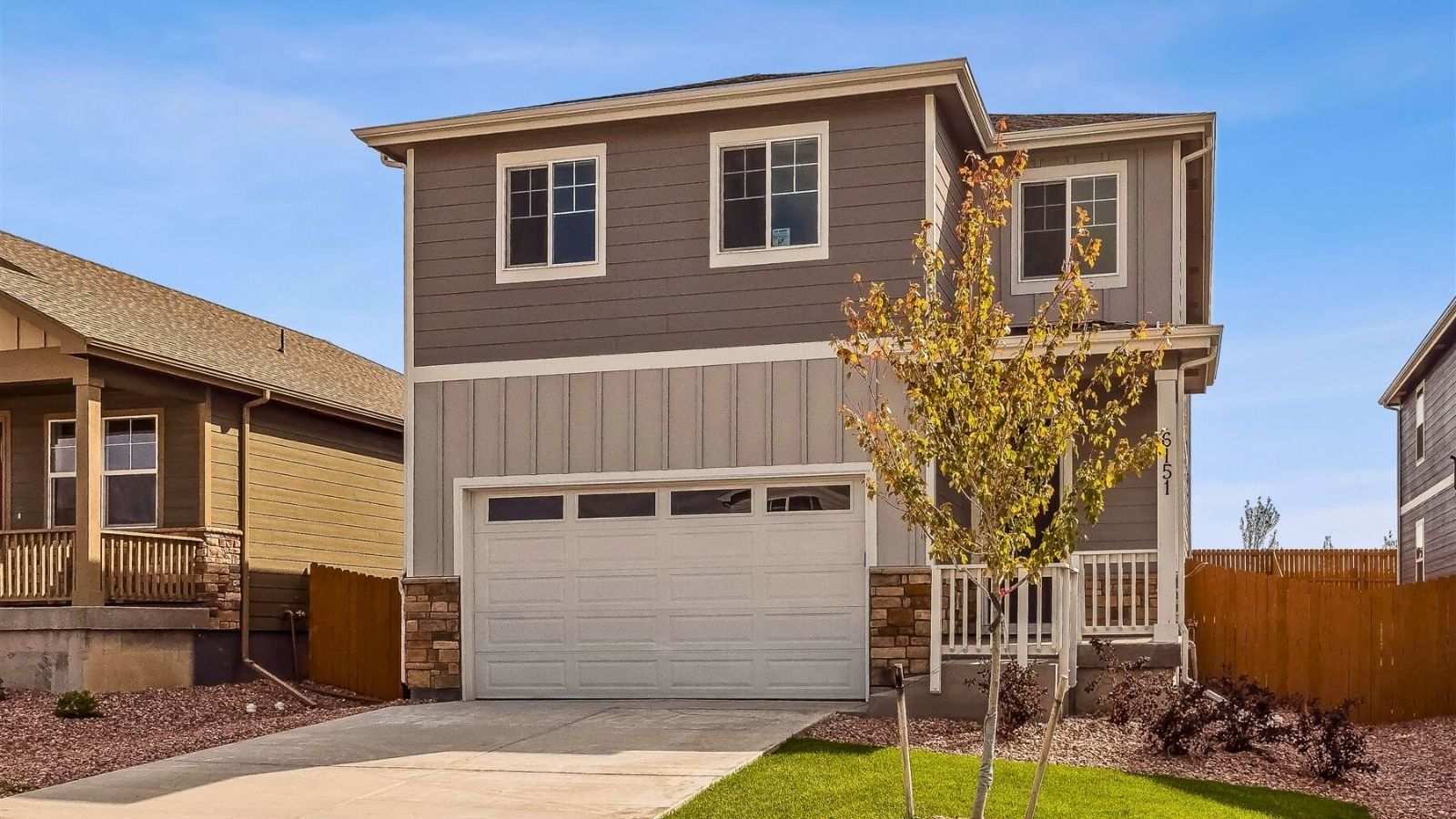 Front exterior view of a two‑story new construction home in The Ridge at Johnstown, Colorado.