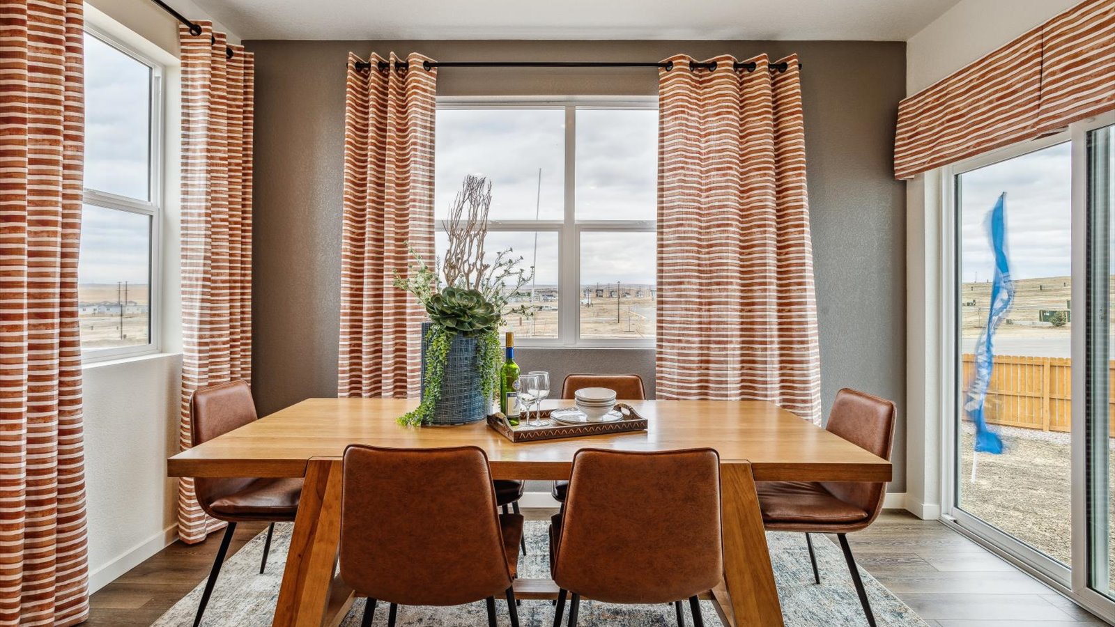 Dining room with orange accent decor