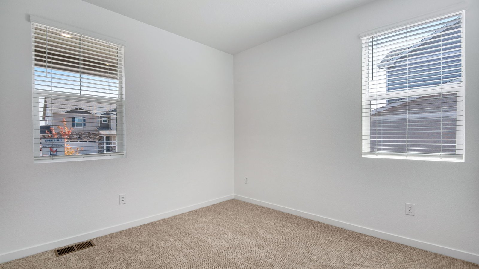 Secondary bedroom in the Harmony floor plan featuring flexible space for family members, guests, or a home office.