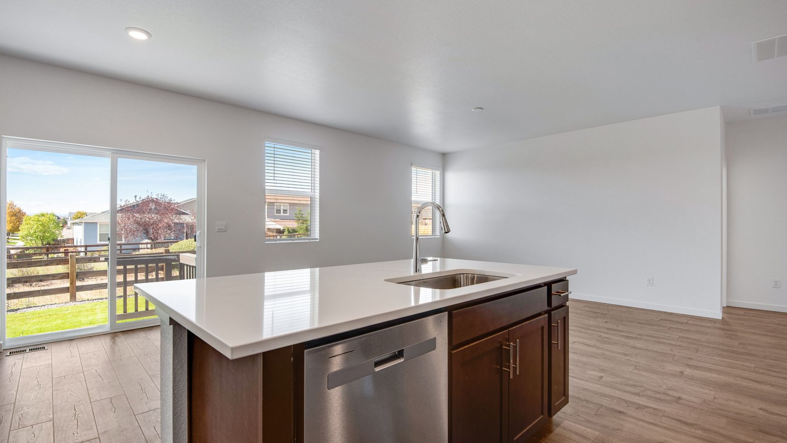 Open kitchen and dining area in the Harmony floor plan showcasing modern finishes, spacious countertops, and connected living spaces.