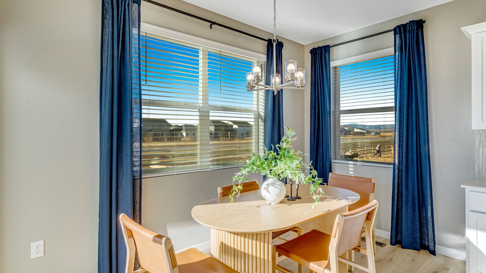 Spacious kitchen island with seating and convenient access to the dining and living areas.