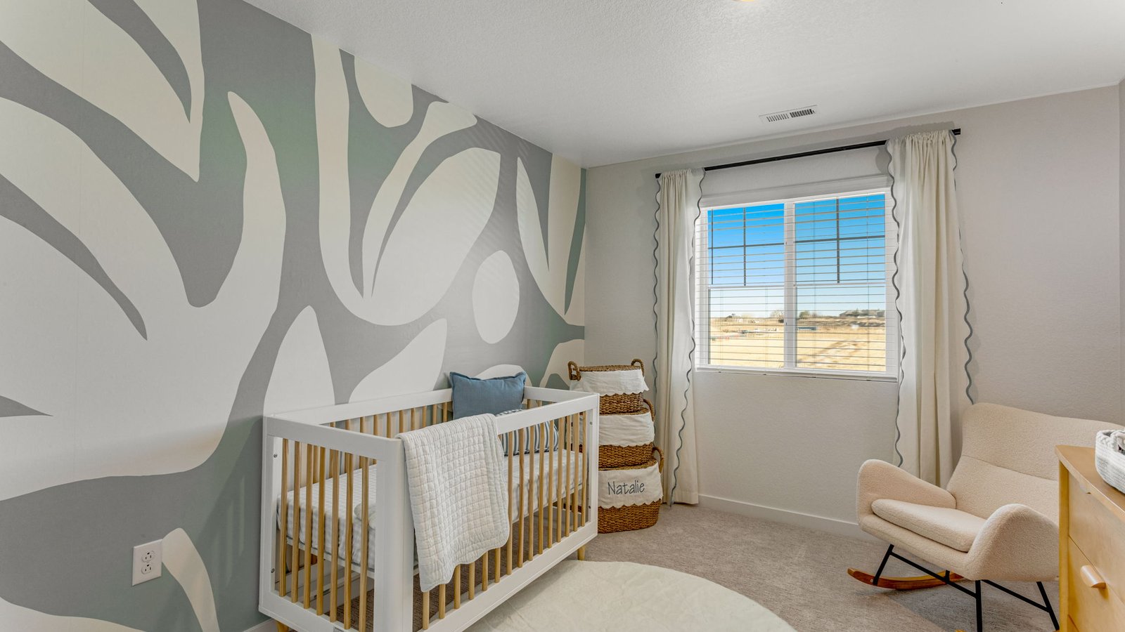 Bright upstairs bedroom featuring a versatile layout and ample closet space.