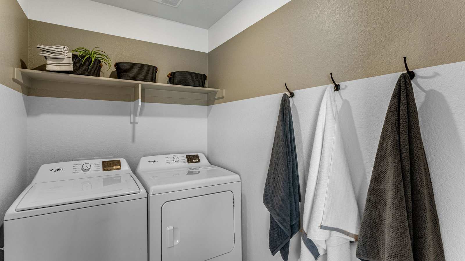Convenient upstairs laundry room located near all bedrooms.