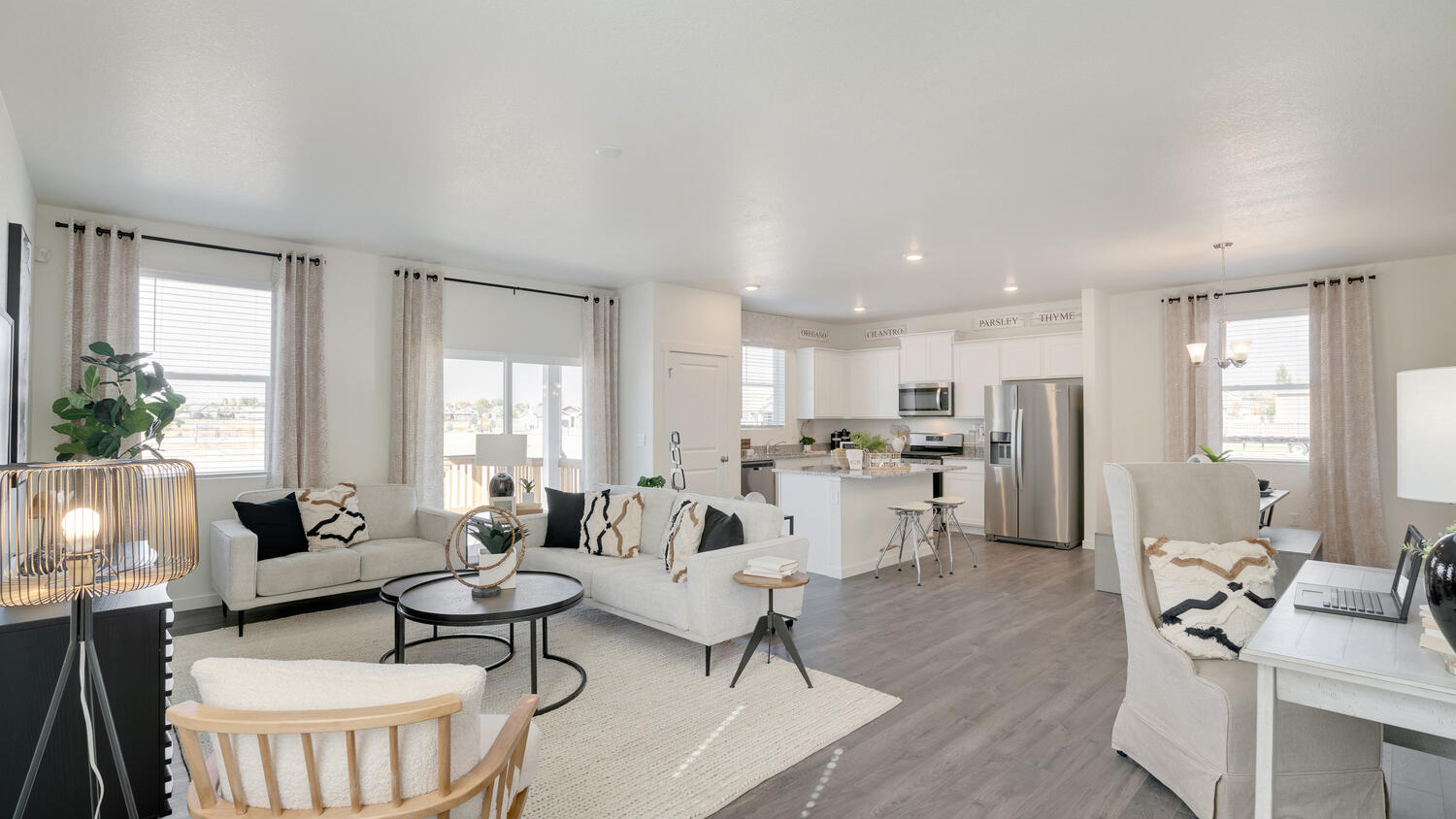 Spacious great room in the Elder floor plan featuring abundant natural light and an open layout.