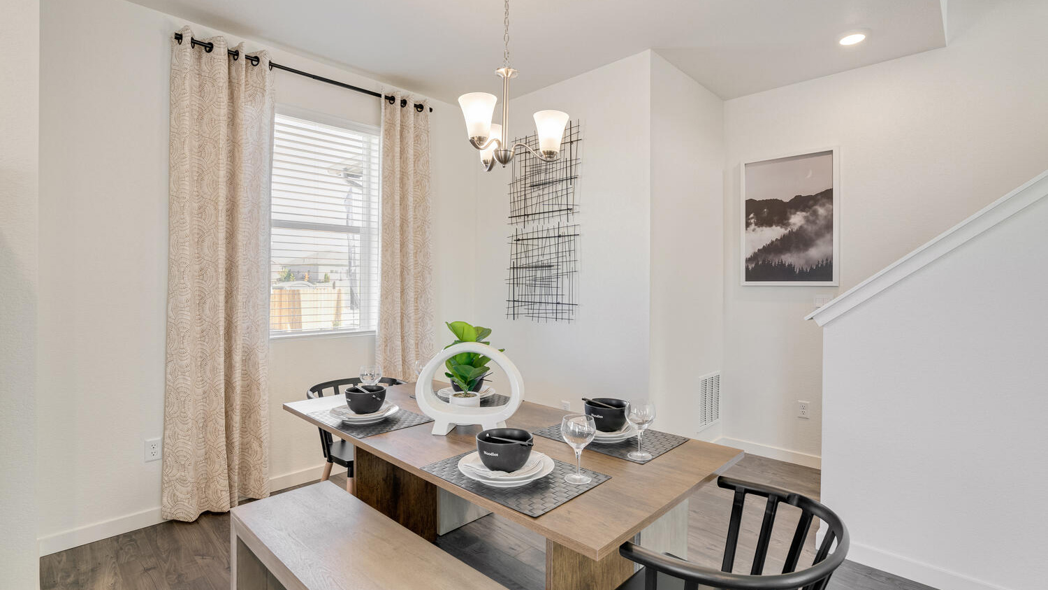 Open dining area in the Elder floor plan positioned between the kitchen and great room.