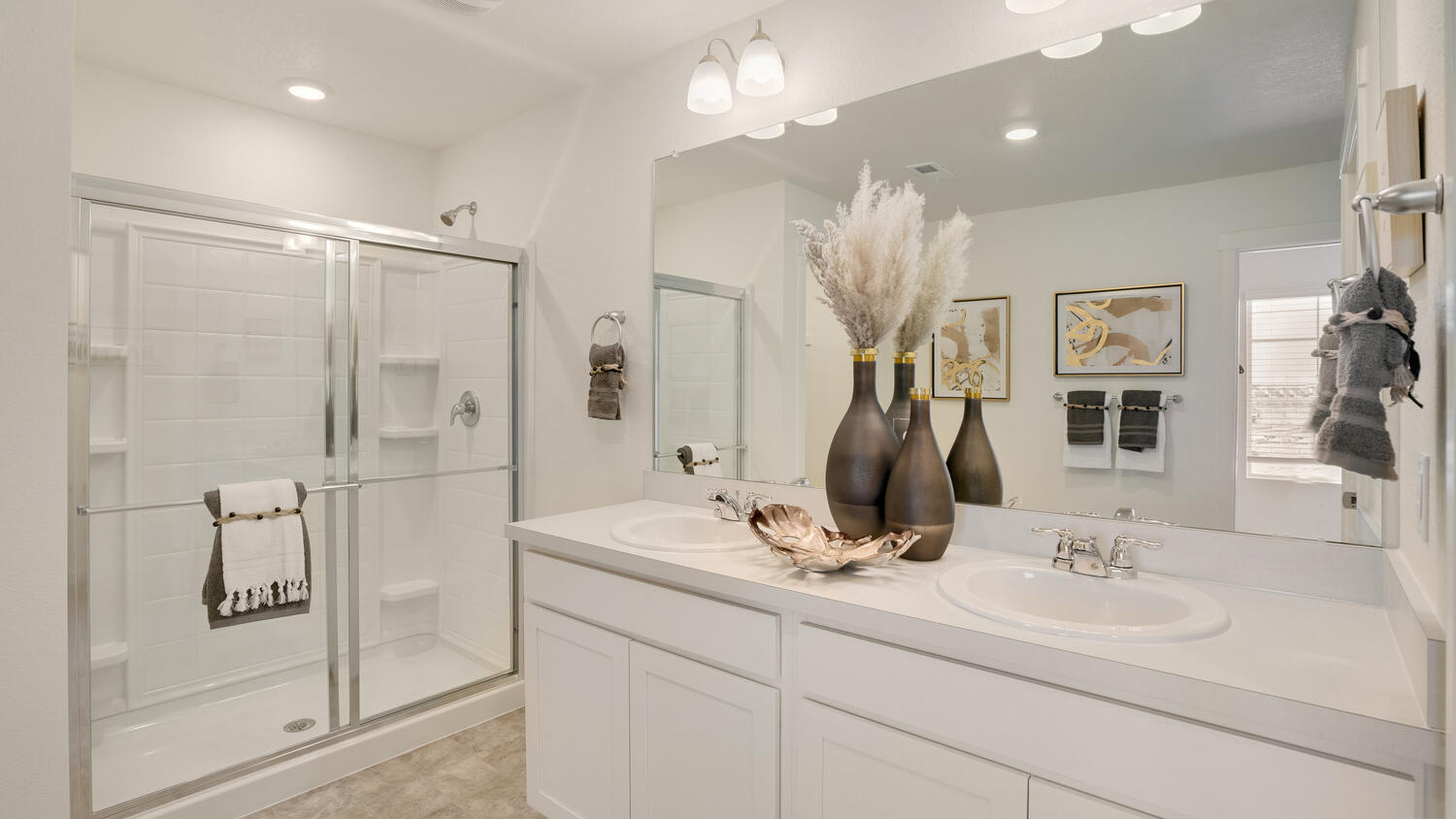 Spacious primary bath connected to the owner's suite in the Elder home.