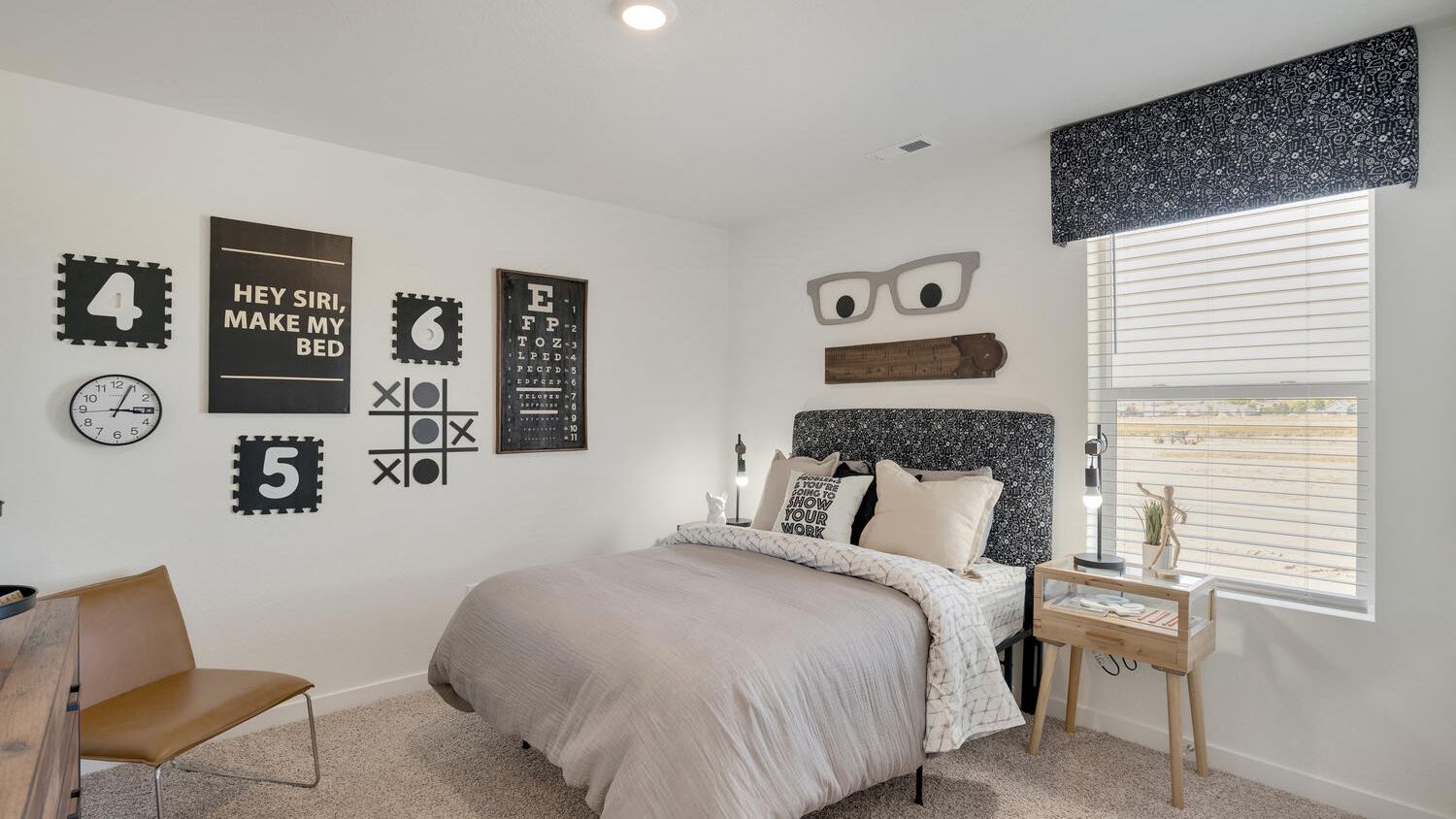 Secondary bedroom in the Elder floor plan offering flexible space for family, guests, or a home office.