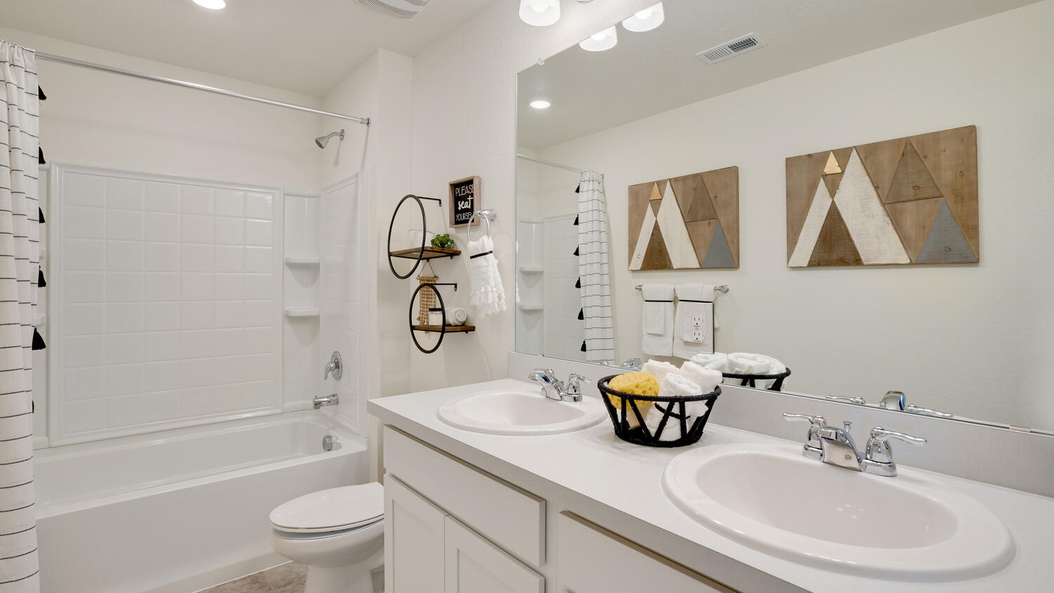 Modern bathroom in the Elder home featuring contemporary finishes and practical storage.