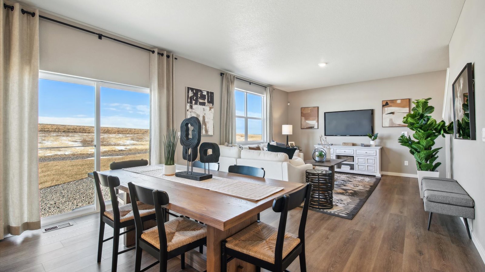 Dining area with modern finishes and seamless flow to the kitchen and living room.
