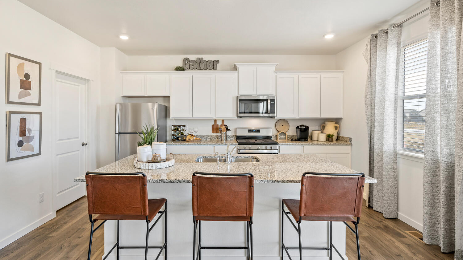 Kitchen with white cabinets in new home