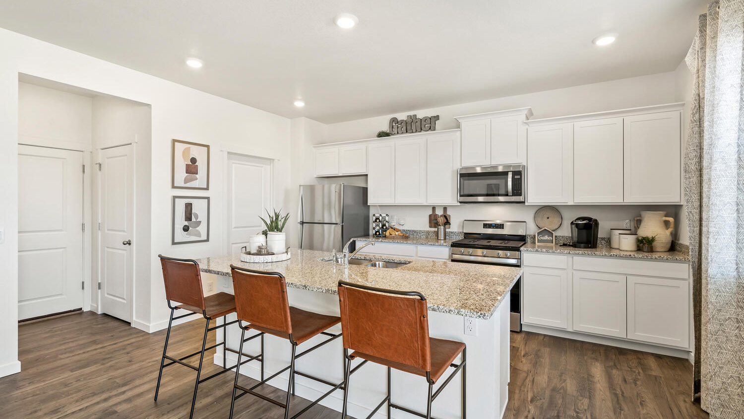 Kitchen with stainless steel appliances in D.R. Horton home