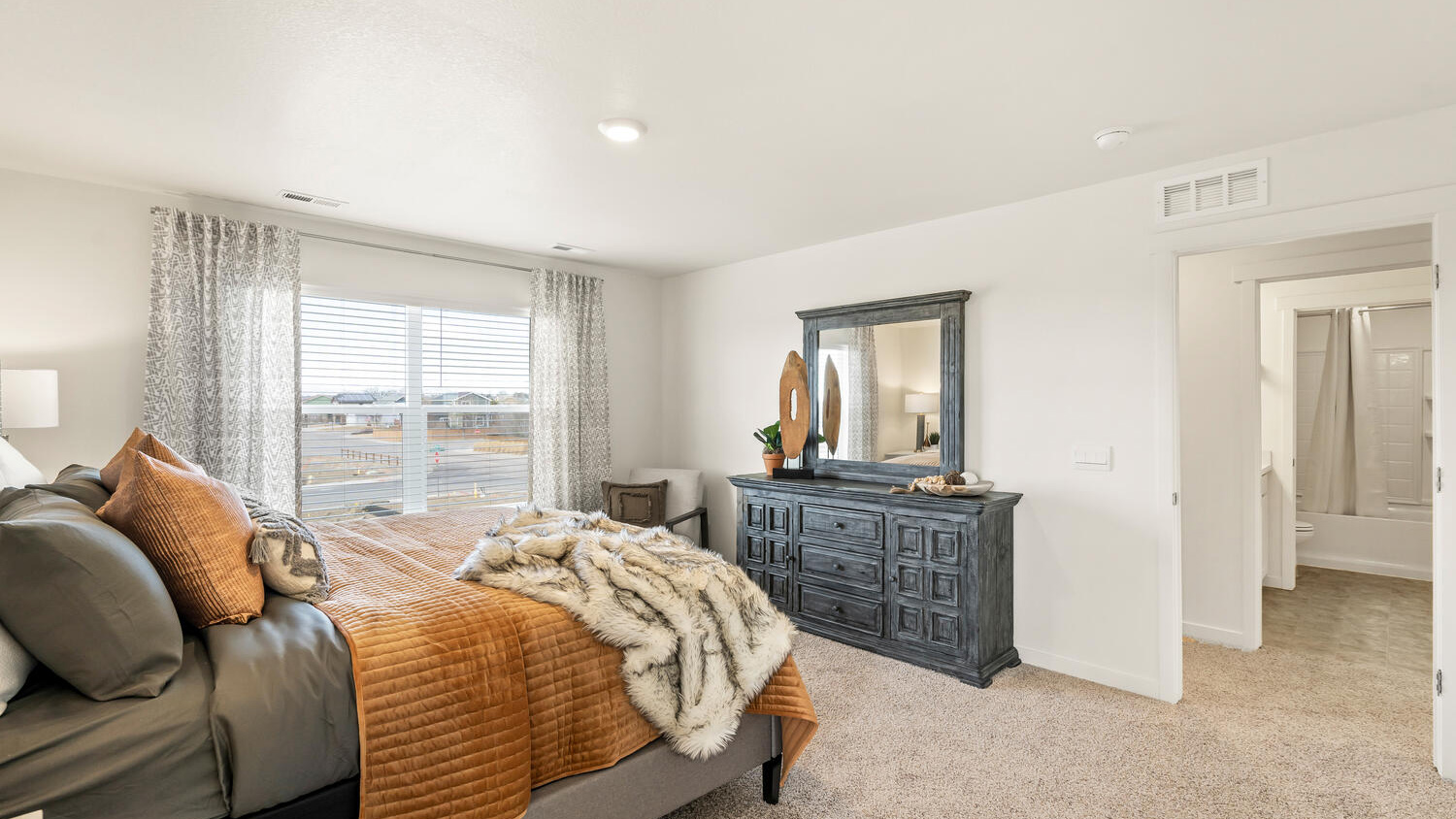 Primary bedroom with large windows in severance colorado