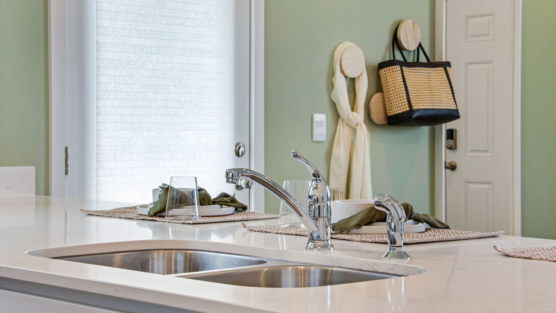 sink in kitchen of new model home by d.r. horton
