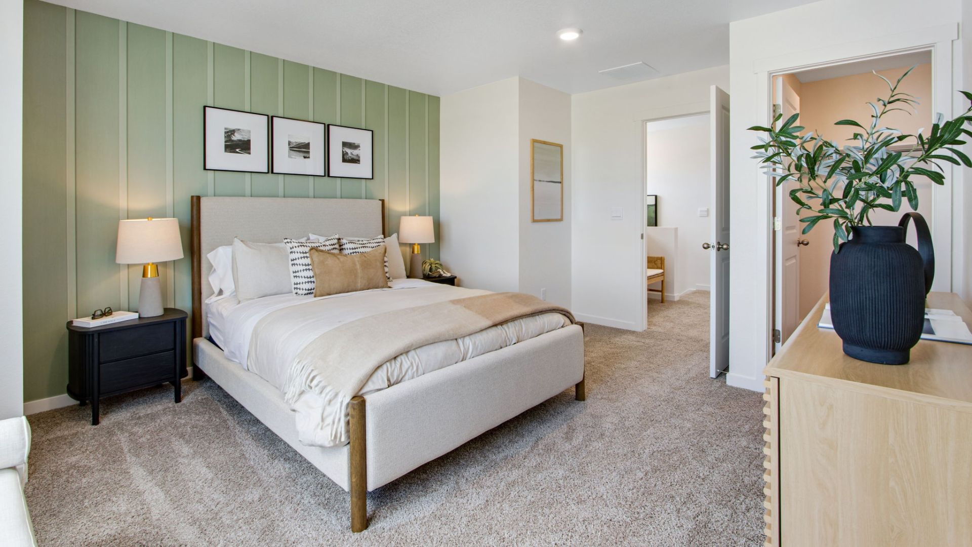 Spacious primary bedroom in the New Haven floor plan with large windows and natural light.