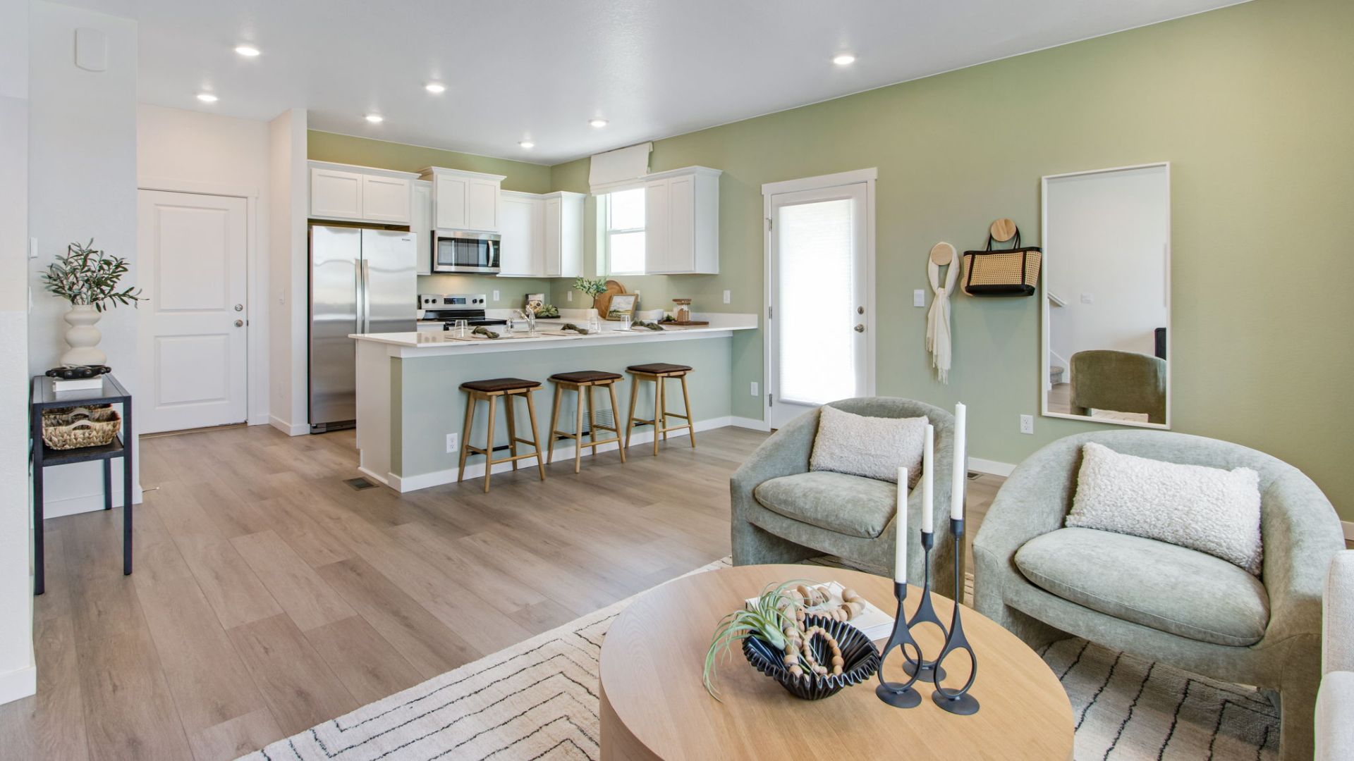 Bright living area connected to the kitchen and dining space in the New Haven home.