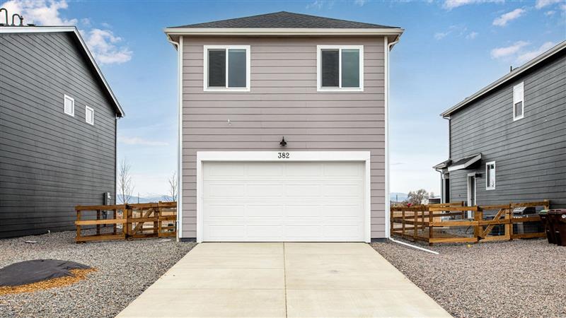 two story home with garage