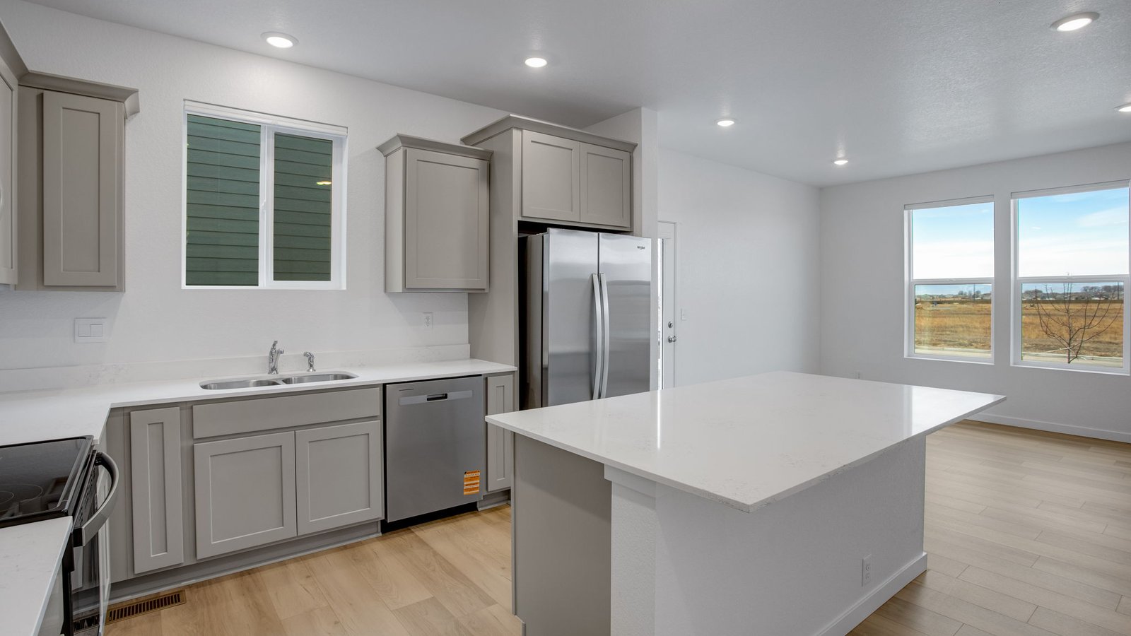 Open-concept kitchen designed for entertaining with ample workspace and convenient island seating.