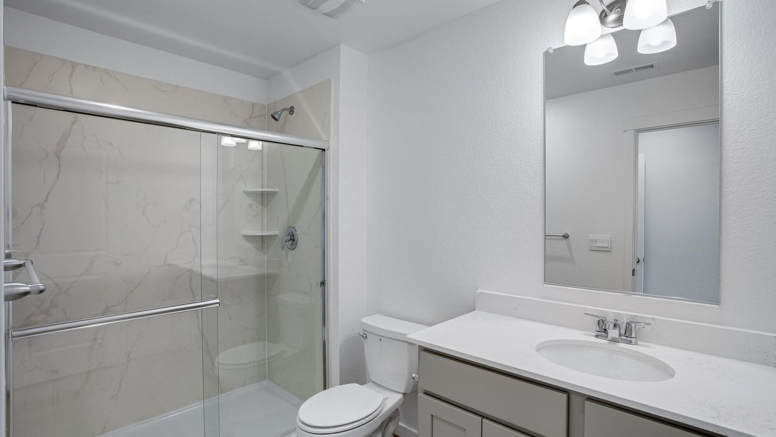 Private ensuite bathroom with modern fixtures and a functional layout designed for everyday convenience.