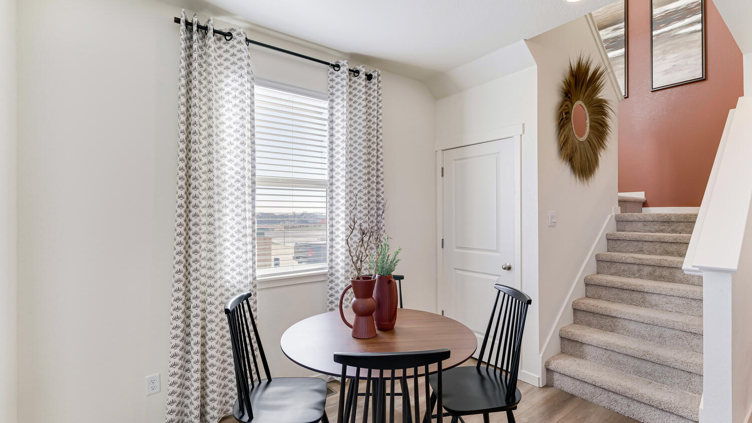 Dining area located adjacent to the kitchen in the Melbourne floorplan at Revere at Johnstown.