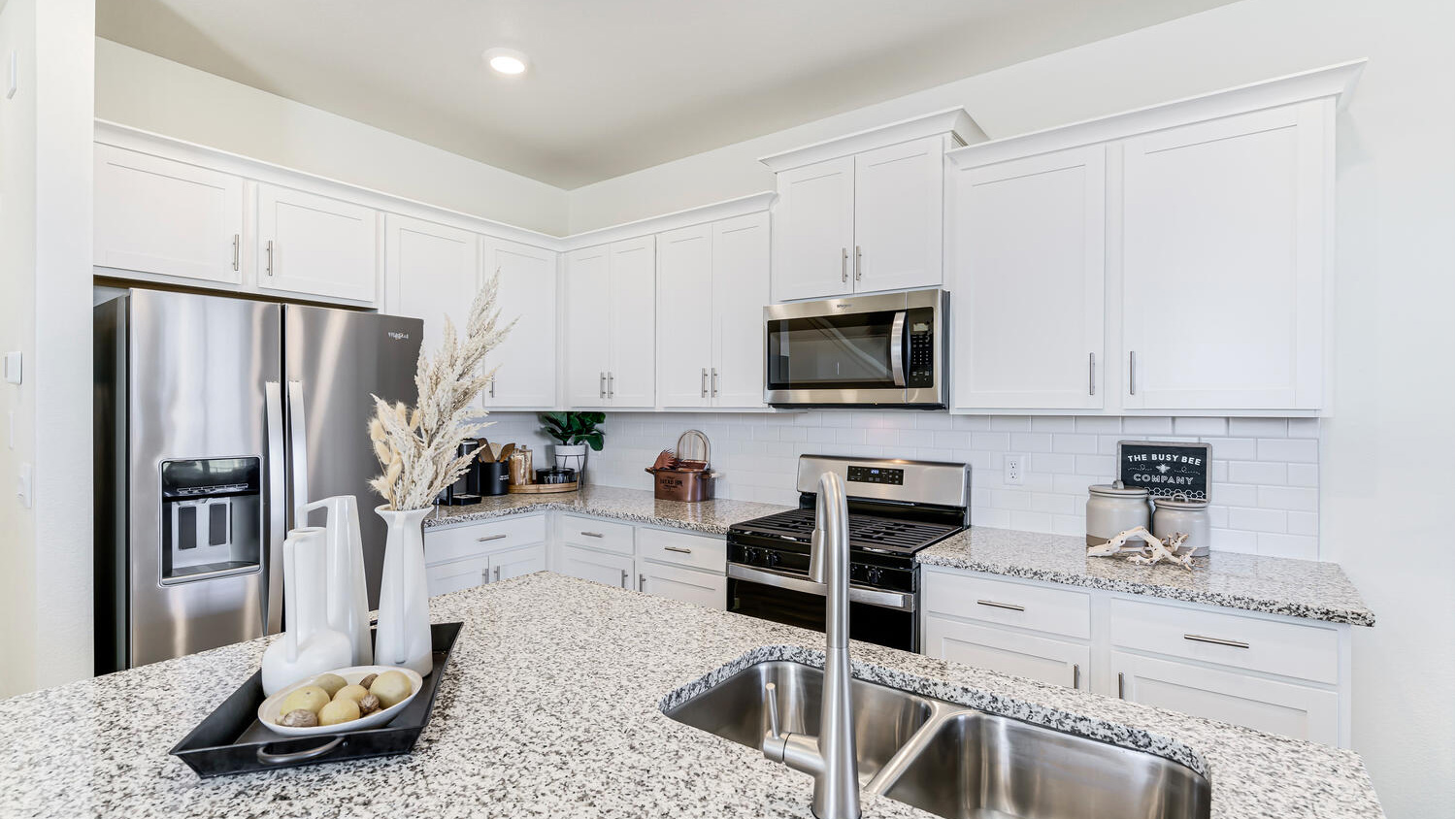 Modern kitchen with quartz countertops, stainless steel appliances, and an oversized island for entertaining.