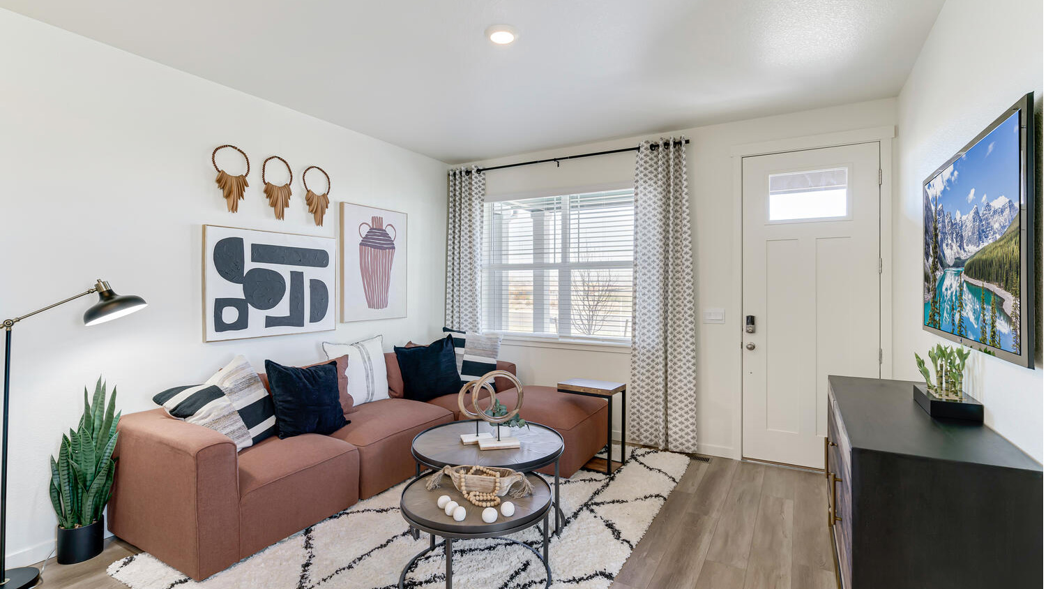 Open-concept great room with abundant natural light and seamless flow into the kitchen and dining space.