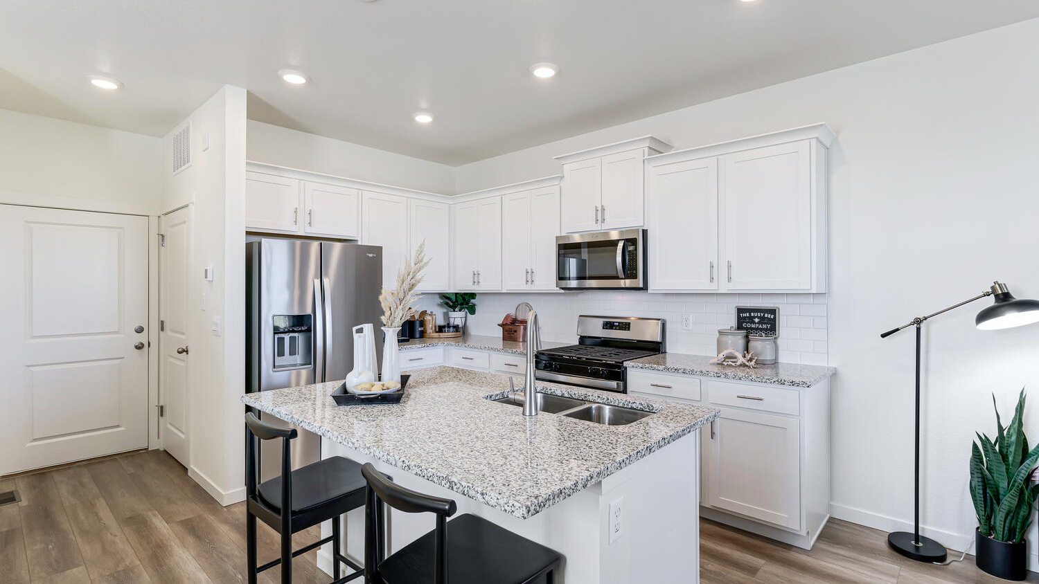 Modern kitchen with quartz countertops, stainless steel appliances, and an oversized island for entertaining.