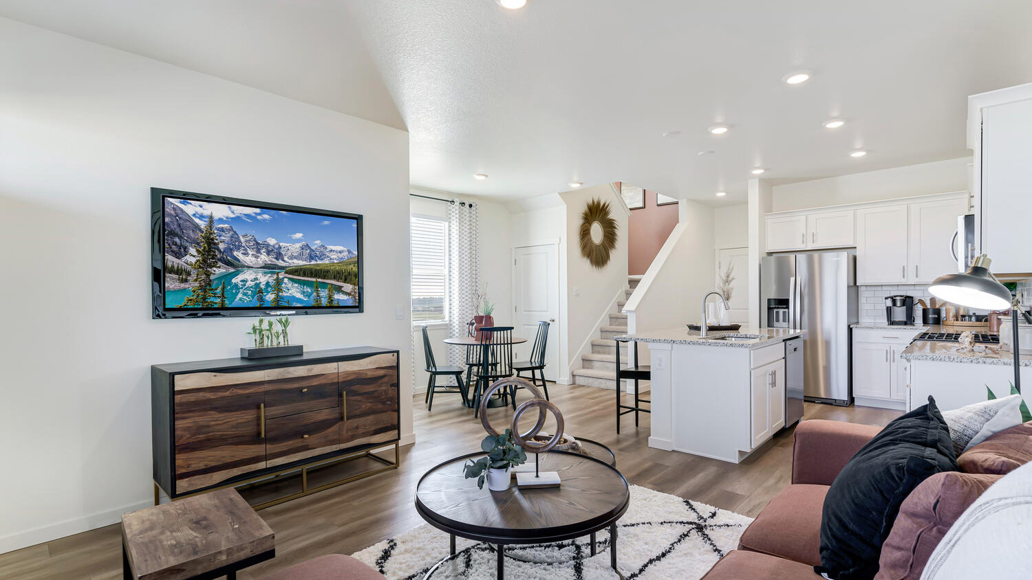 Open-concept great room with abundant natural light and seamless flow into the kitchen and dining space.