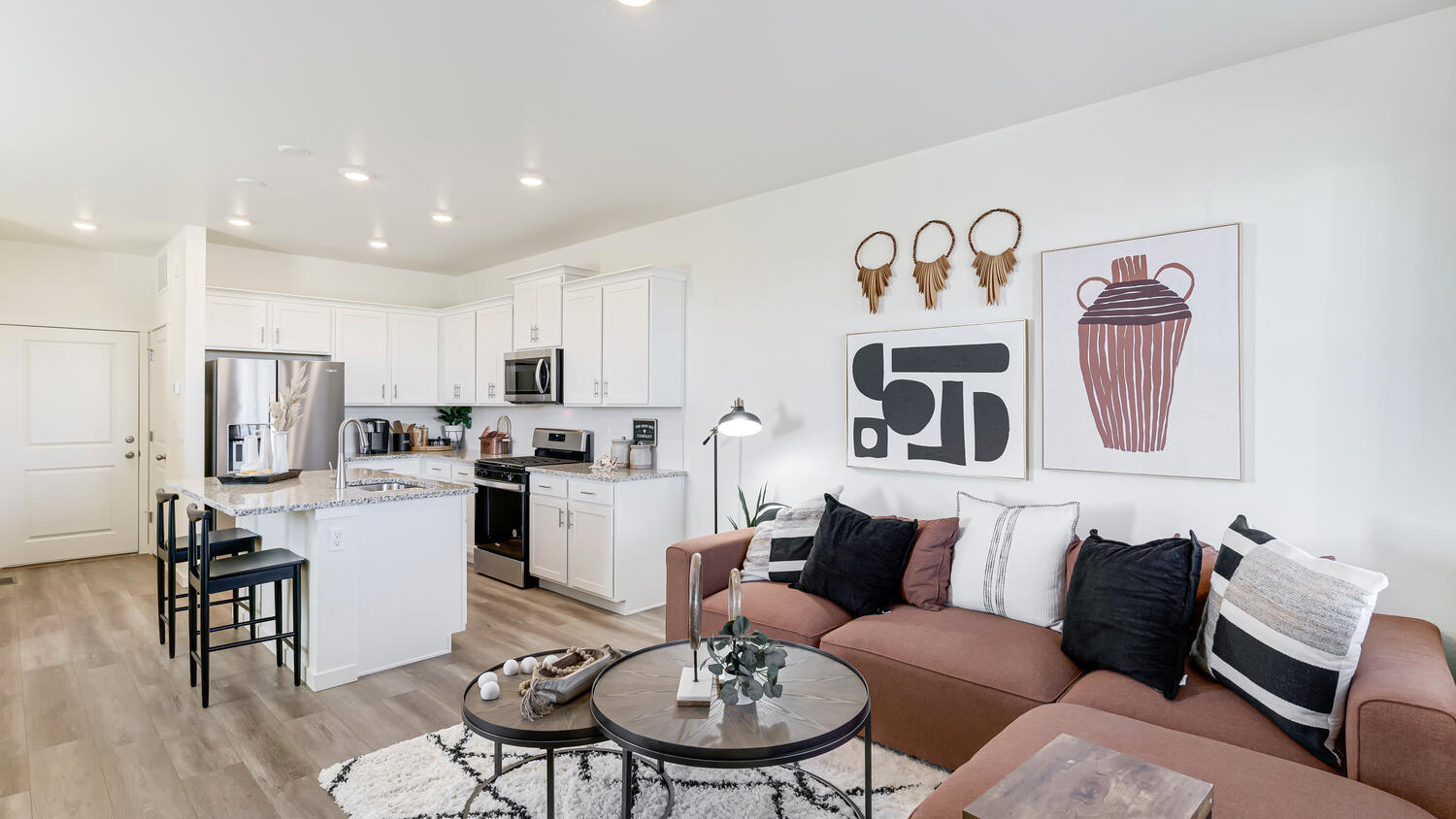 Spacious great room featuring modern finishes and an open layout connecting the home's main living areas.