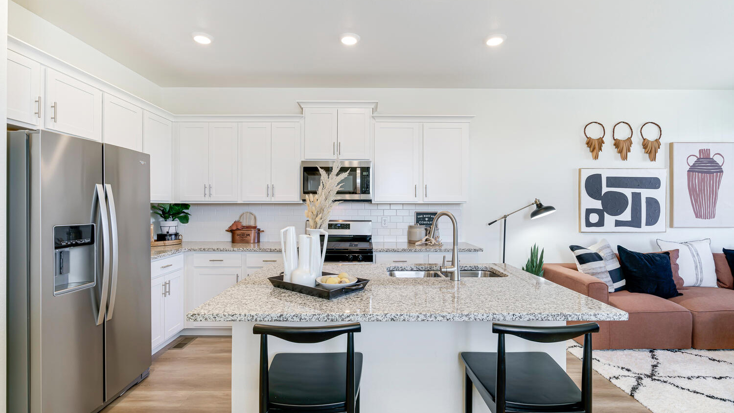 Modern kitchen with quartz countertops, stainless steel appliances, and an oversized island for entertaining.