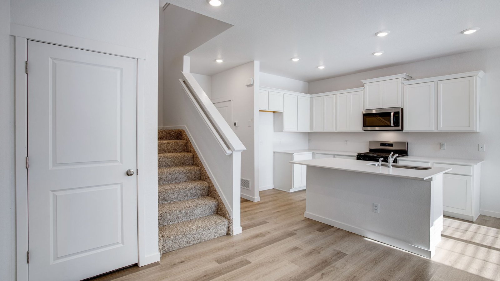 kitchen and stairs of paired home johnstown, co