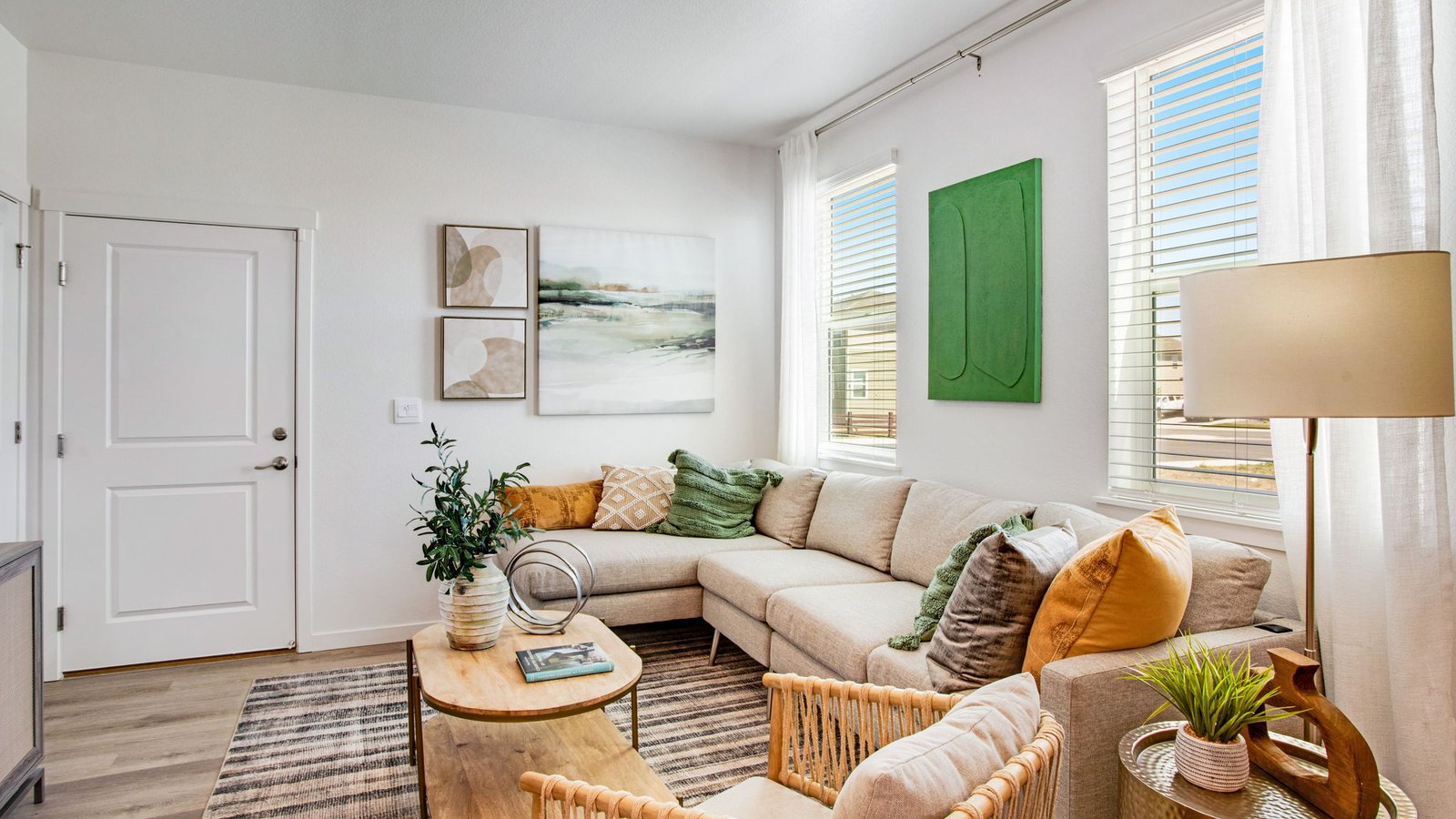 Spacious living room in the Muirfield floor plan featuring an open layout and abundant natural light.