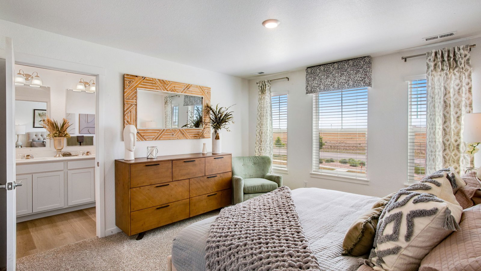 Private primary suite in the Muirfield floor plan featuring a spacious layout and walk-in closet.