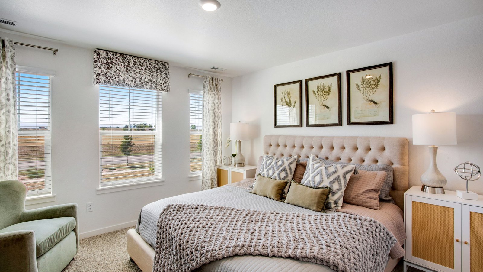 Relaxing primary bedroom in the Muirfield home designed as a comfortable retreat.
