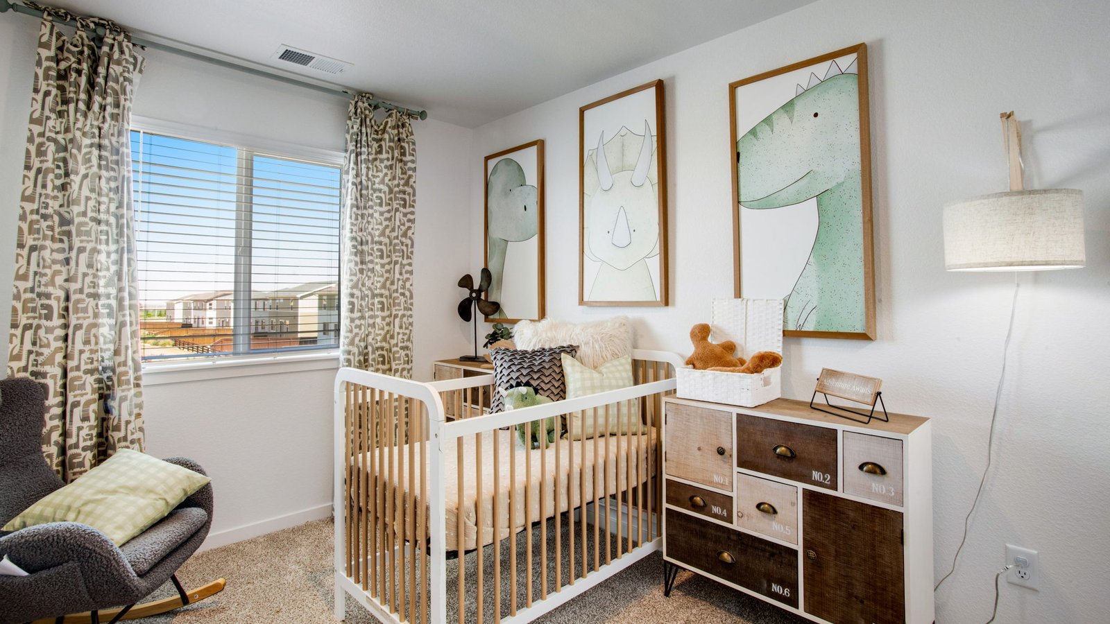 Bright guest bedroom in the Muirfield home featuring ample closet space and natural light.