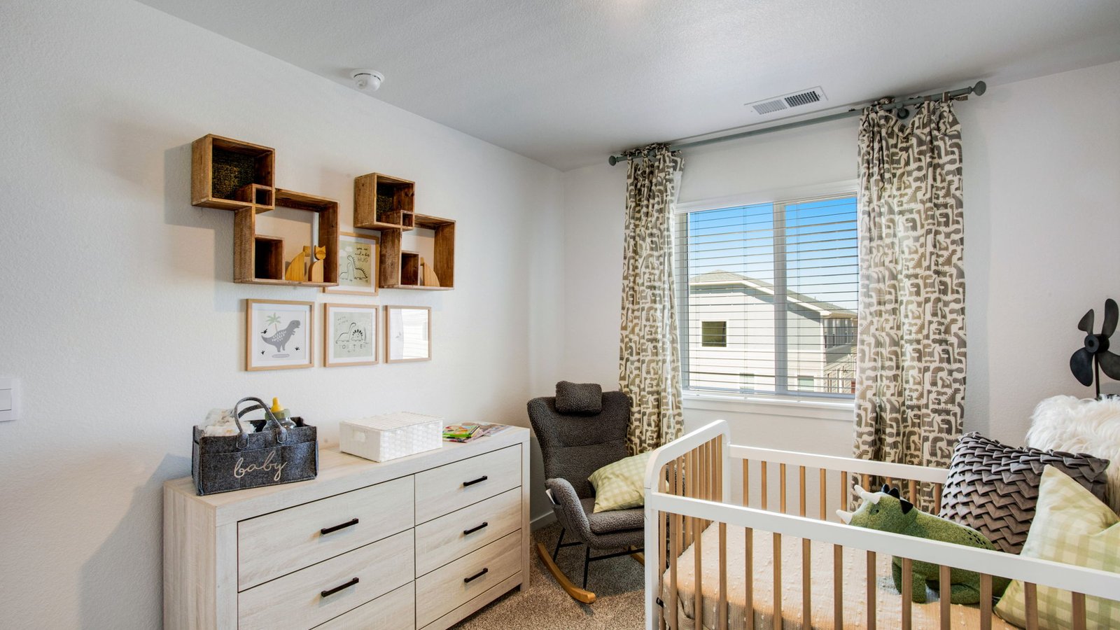 Spacious upstairs bedroom in the Muirfield home with modern finishes and practical storage.