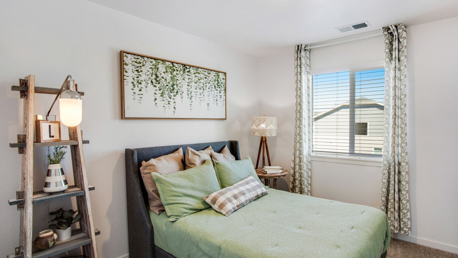 Secondary bedroom in the Muirfield floor plan offering flexible space for family, guests, or a home office.