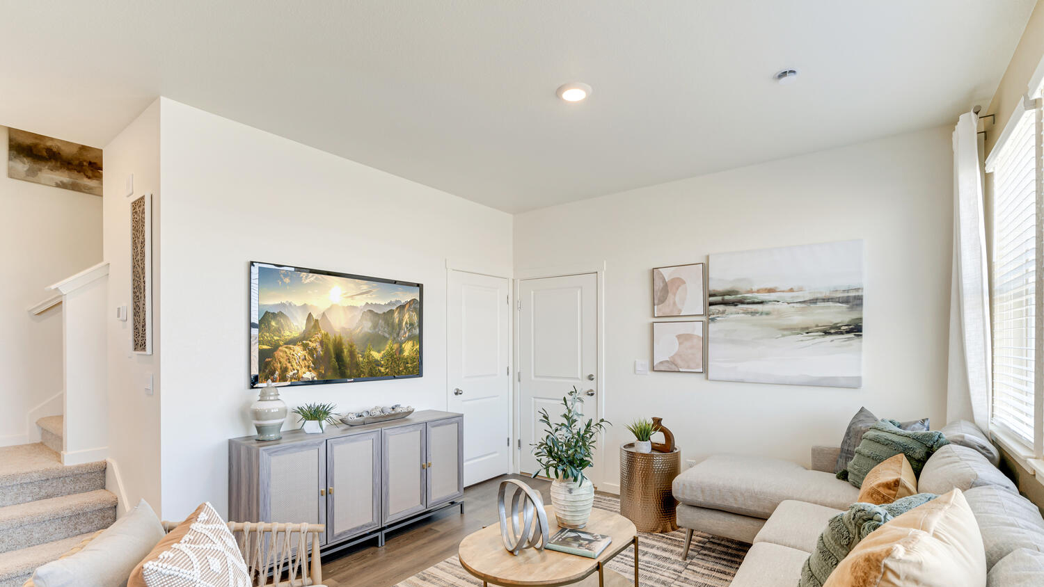 Contemporary family room in the Muirfield home offering flexible gathering space and comfort.