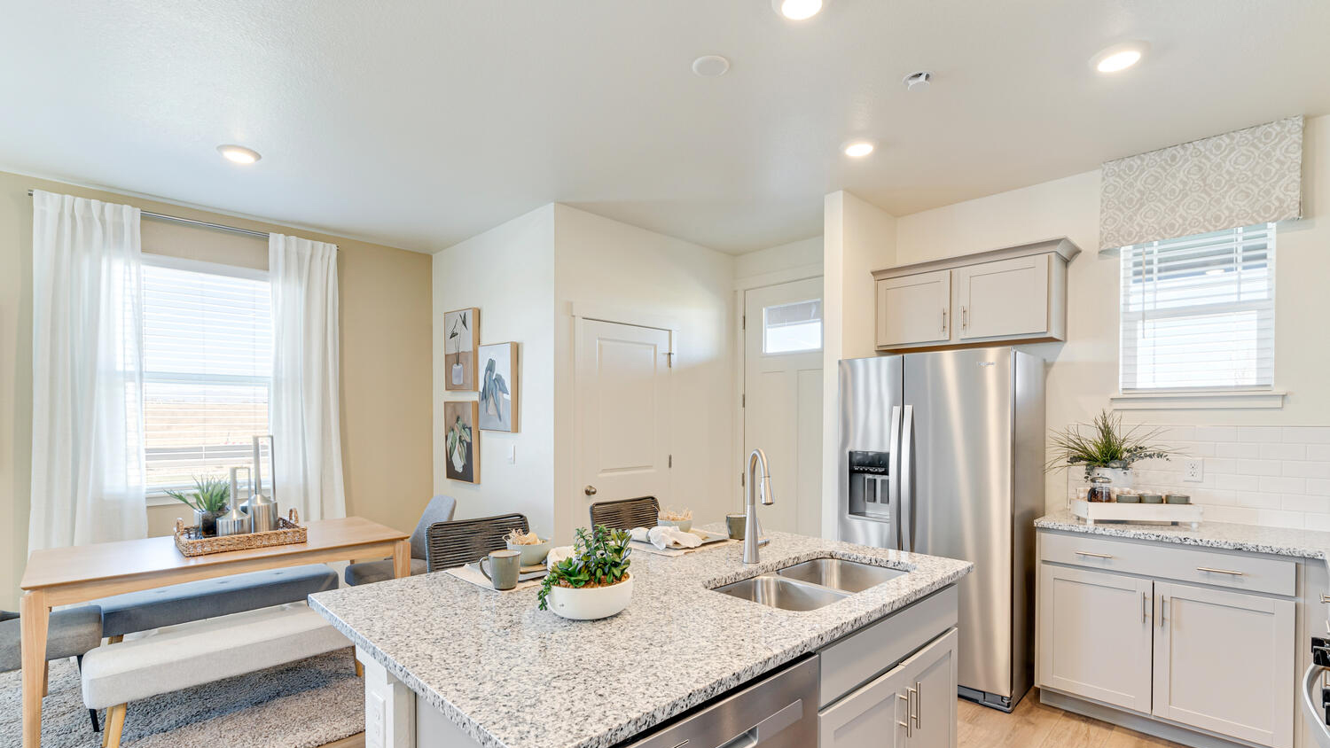 Stylish kitchen in the Muirfield home showcasing a large center island and functional layout.