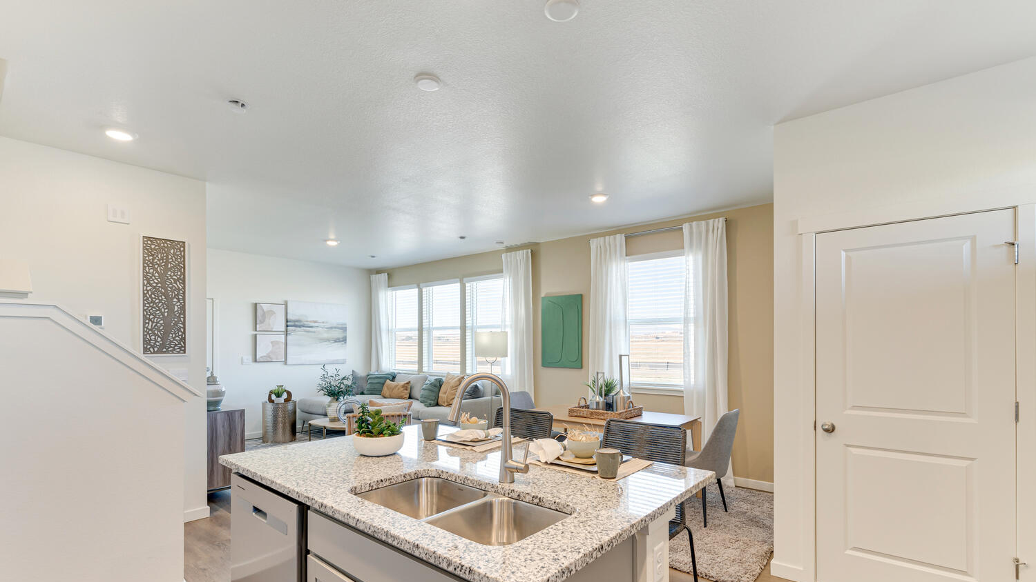 Open-concept kitchen in the Muirfield floor plan connecting seamlessly to the dining and living areas.