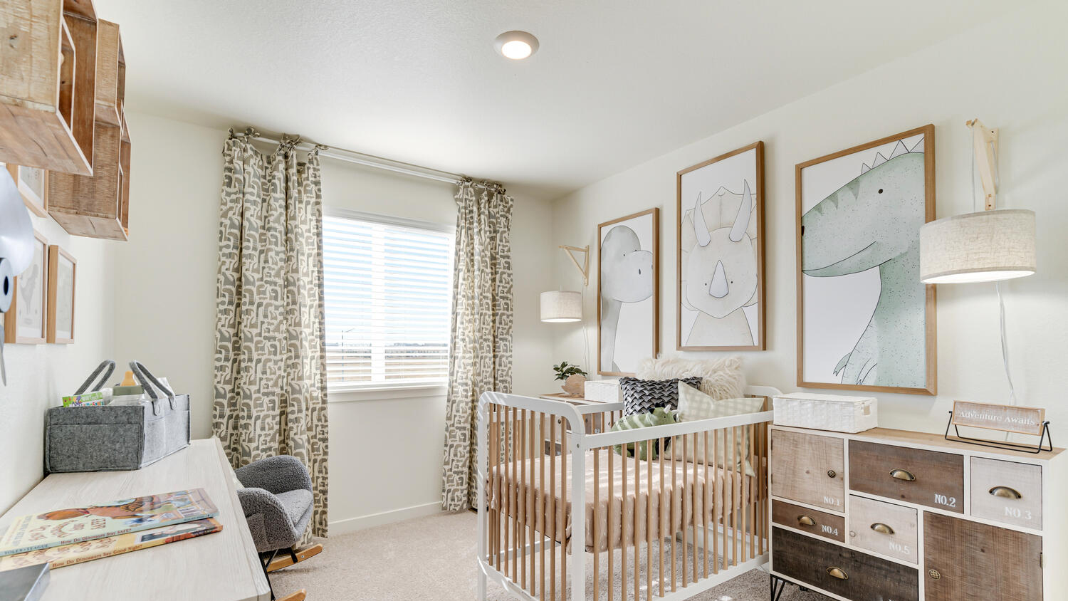 Bright guest bedroom in the Muirfield home featuring ample closet space and natural light.