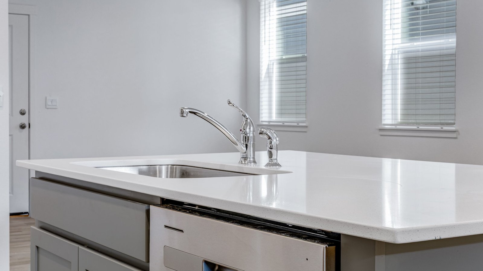 kitchen island with dishwasher in d.r. horton paired home johnstown, co