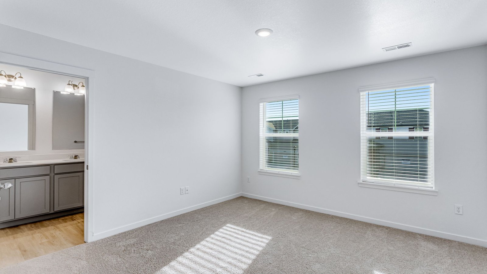 primary bedroom with large windows