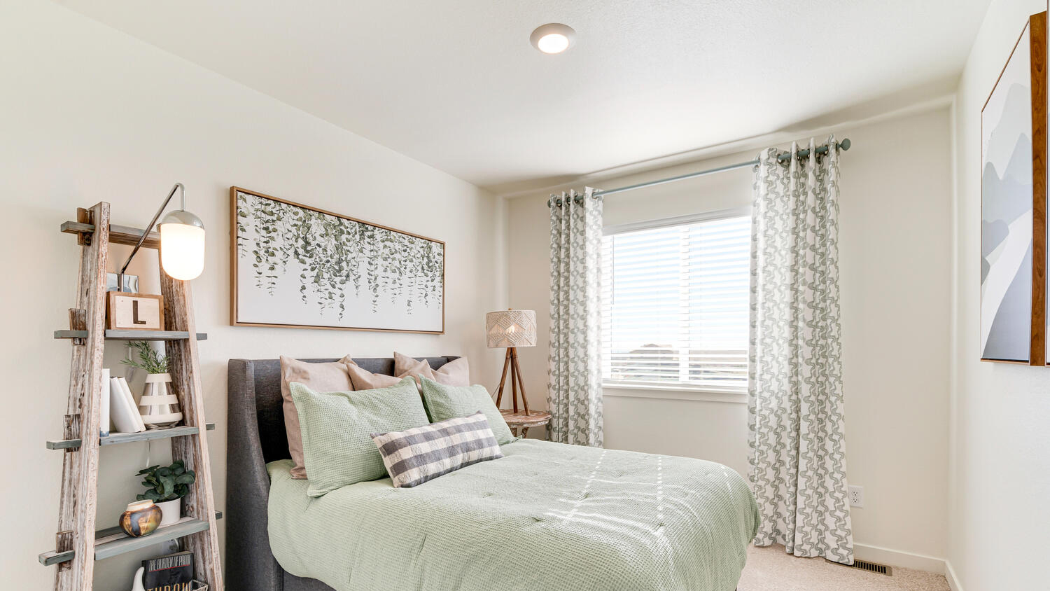 Guest bedroom in model home at Revere at Johnstown community by D.R. Horton in Johnstown, CO