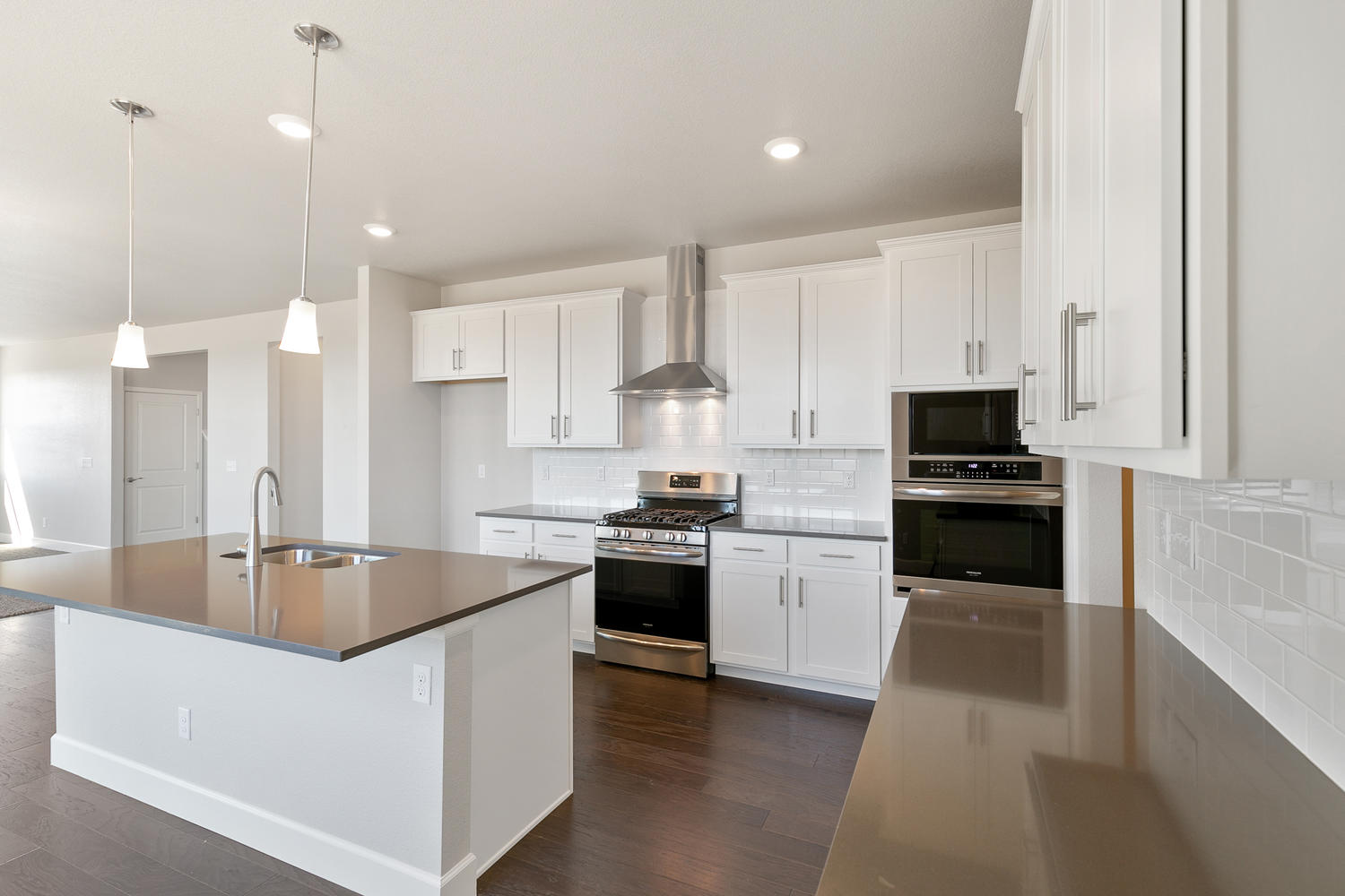 white cabinet kitchen with an island