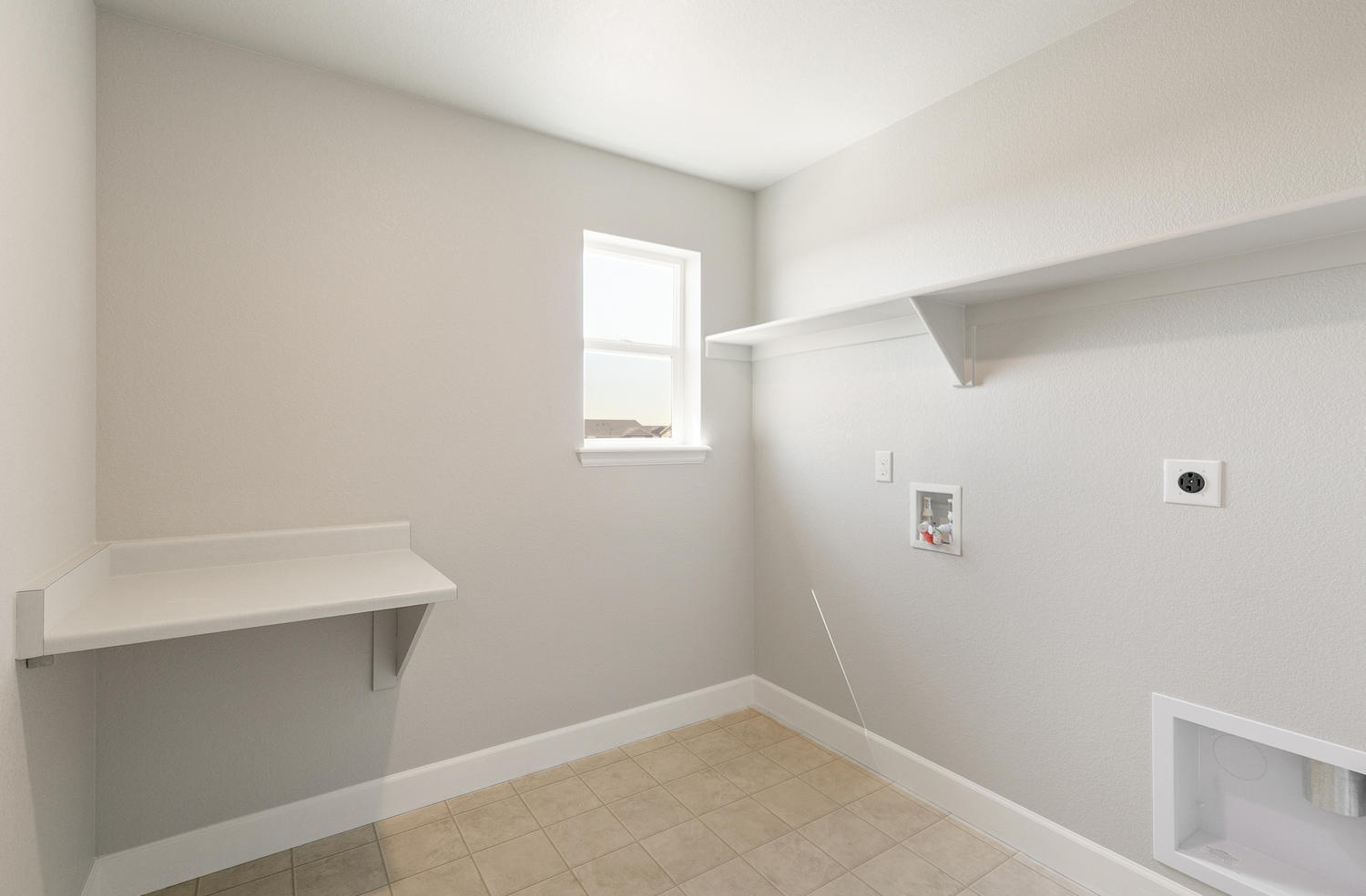 laundry room with washer and dryer hook up and shelves