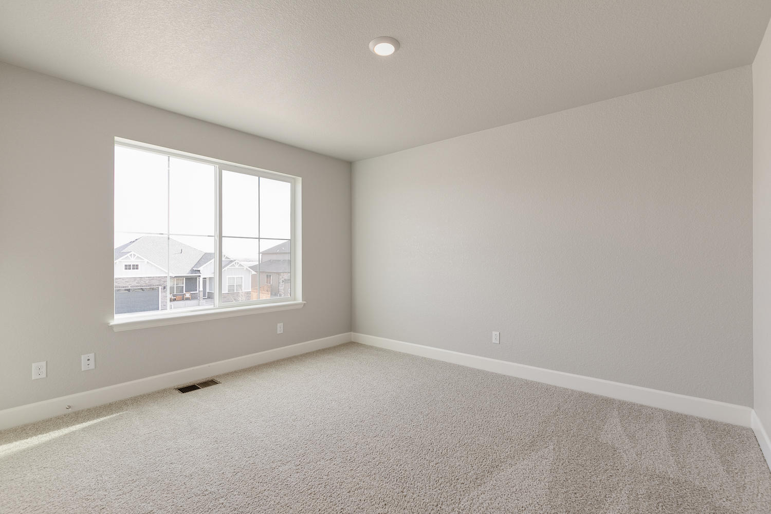 bedroom with a window and carpet floor