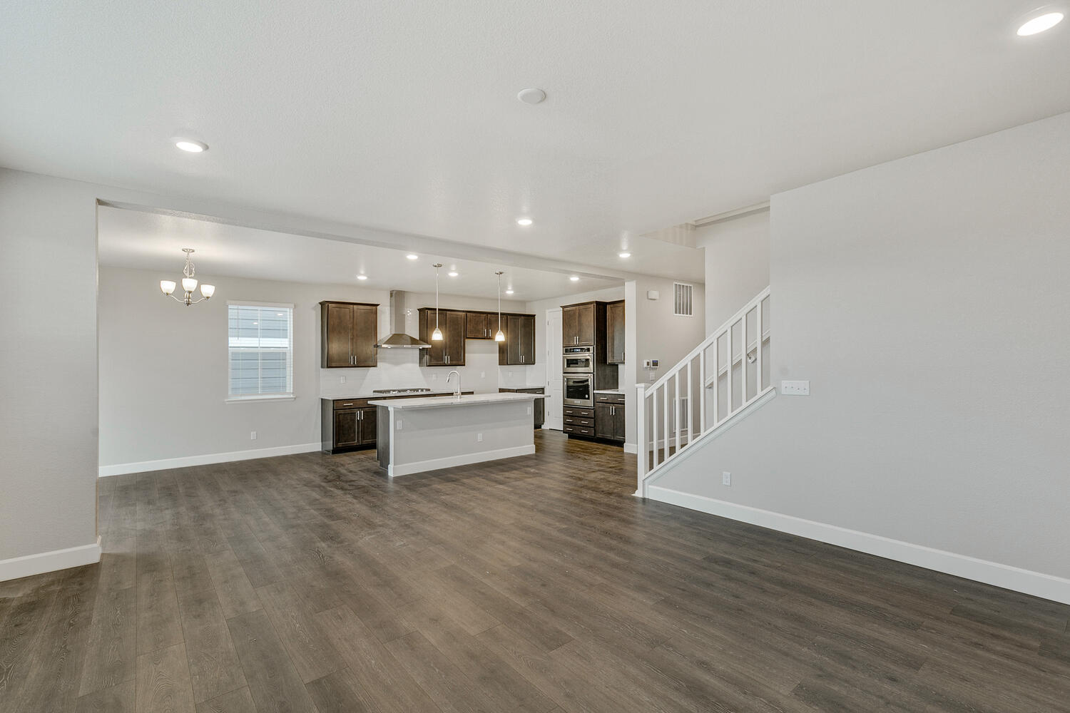 open space living room and  kitchen with hard wood floor